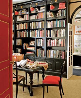 Library-built-ins-bookshelves_black-brown-red-nailhead-door_atelier-branca-designerdigs_traditional-home